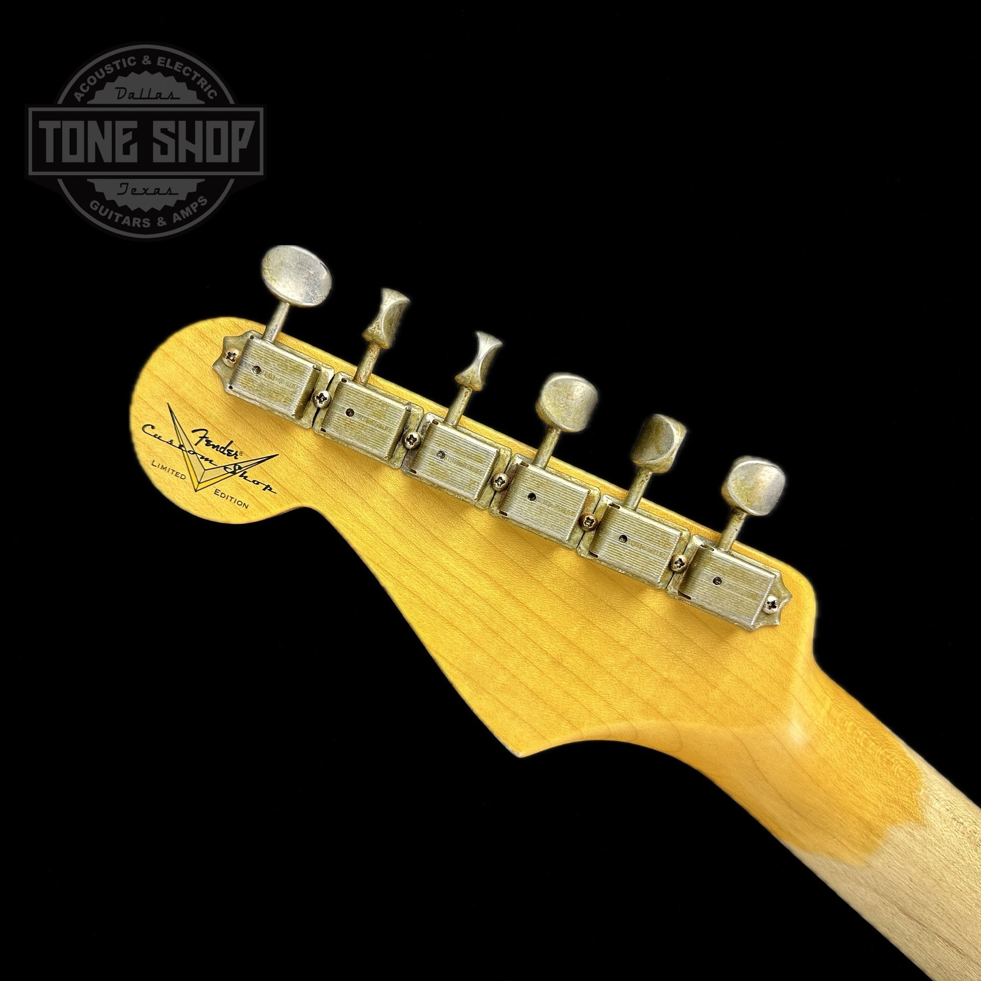 Back of headstock of Fender Custom Shop Limited Edition Late 64 Strat Relic Target 3 Color Sunburst.