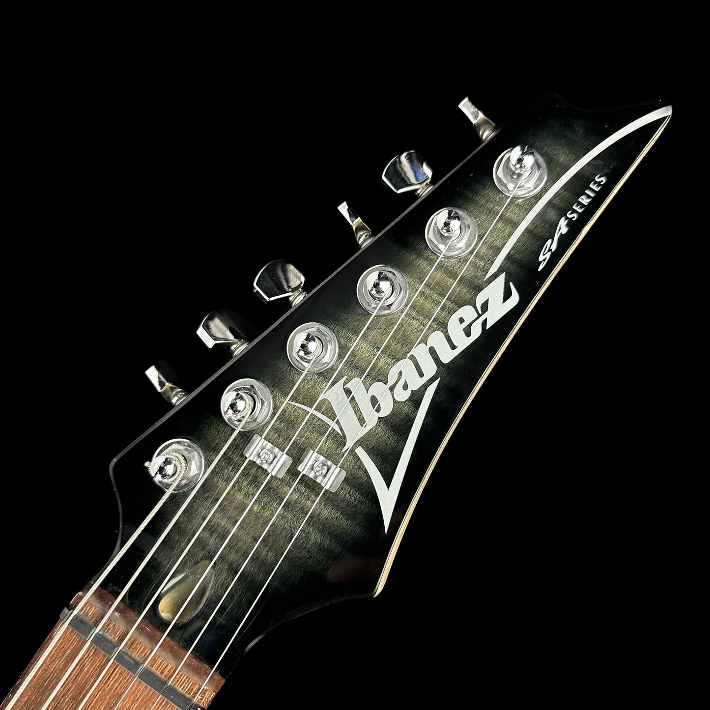 Front of headstock of Used Ibanez SA Flame Top Trans Black.