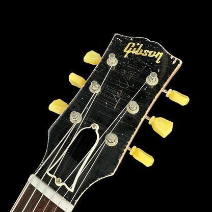 Front of headstock of Gibson Custom Shop Murphy Lab 1959 Les Paul Standard Ultra Heavy Aged Lemon Burst.