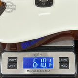 Digital scale displaying weight of a guitar, with 'King Shop' branding.