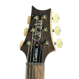 Guitar headstock with 'Custom' branding on a white background