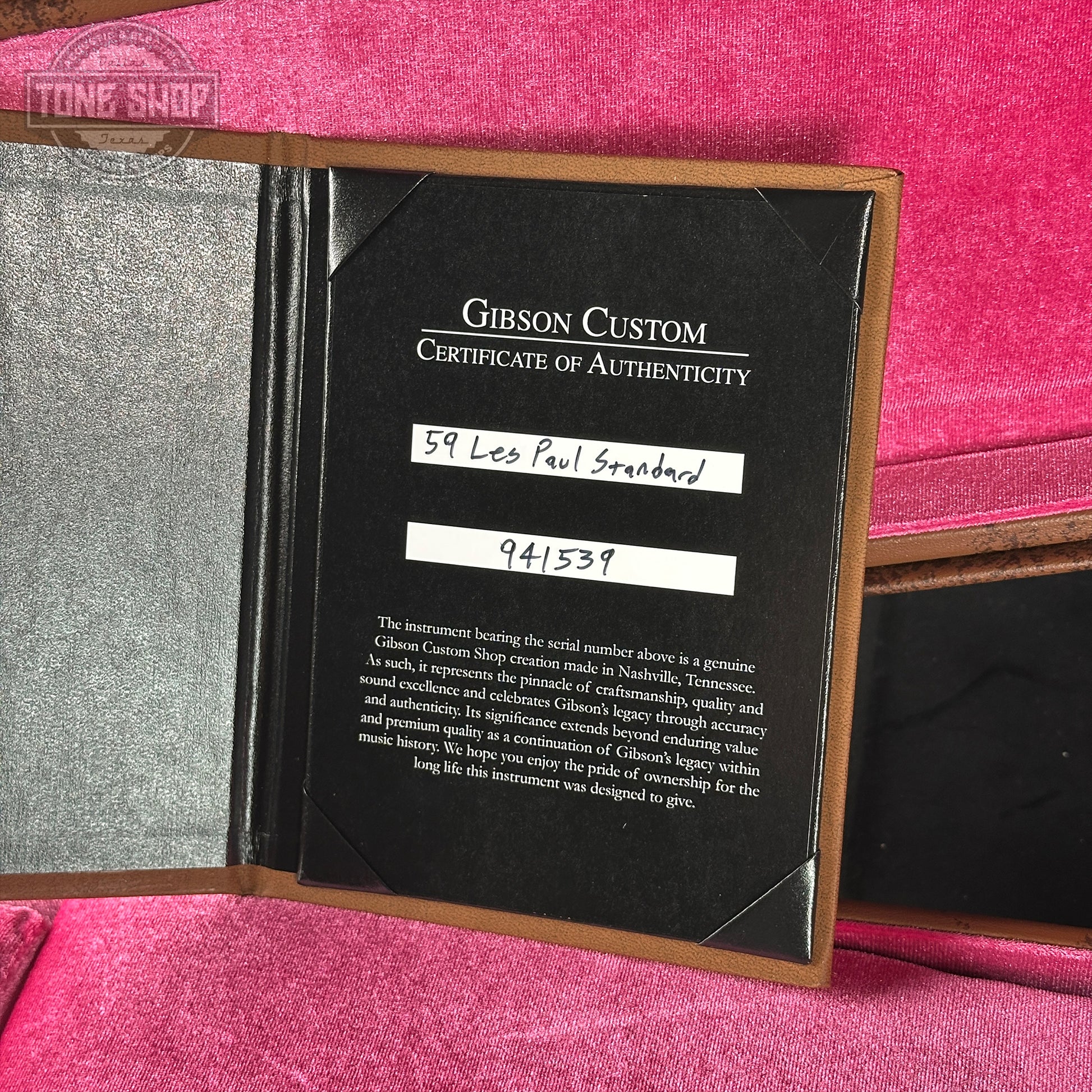Gibson Custom Certificate of Authenticity on a pink surface