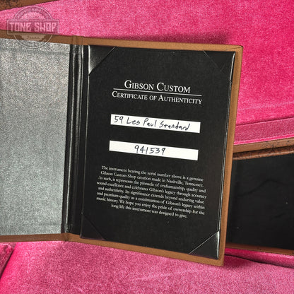 Gibson Custom Certificate of Authenticity on a pink surface