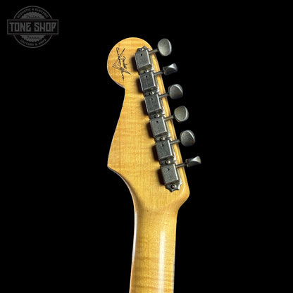 Guitar headstock with tuning pegs on a black background, featuring the Tone Shop logo.