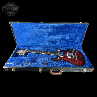 Guitar in a blue case with 'Tone Shop' logo in the corner