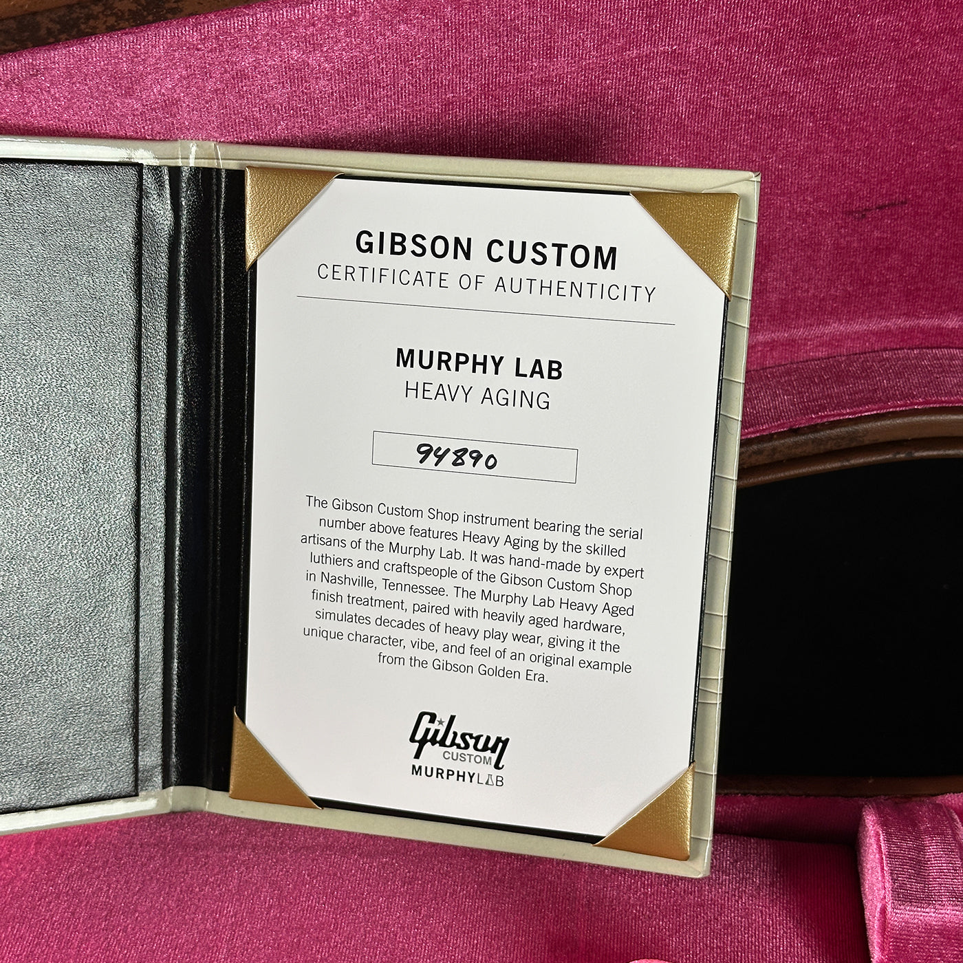 Gibson Custom Certificate of Authenticity for Murphy Lab Heavy Aging on a pink background