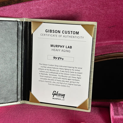 Gibson Custom Certificate of Authenticity for Murphy Lab Heavy Aging on a pink background
