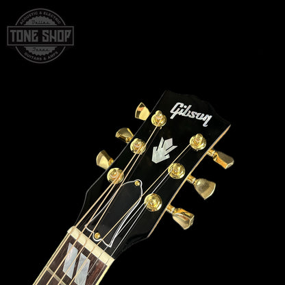 Front of headstock of Gibson Custom Shop M2M All Koa Hummingbird Gold Hardware Grover Tulips.