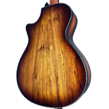 Close-up of a wooden guitar body on a white background