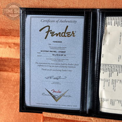 Fender certificate of authenticity in a black frame on an orange background