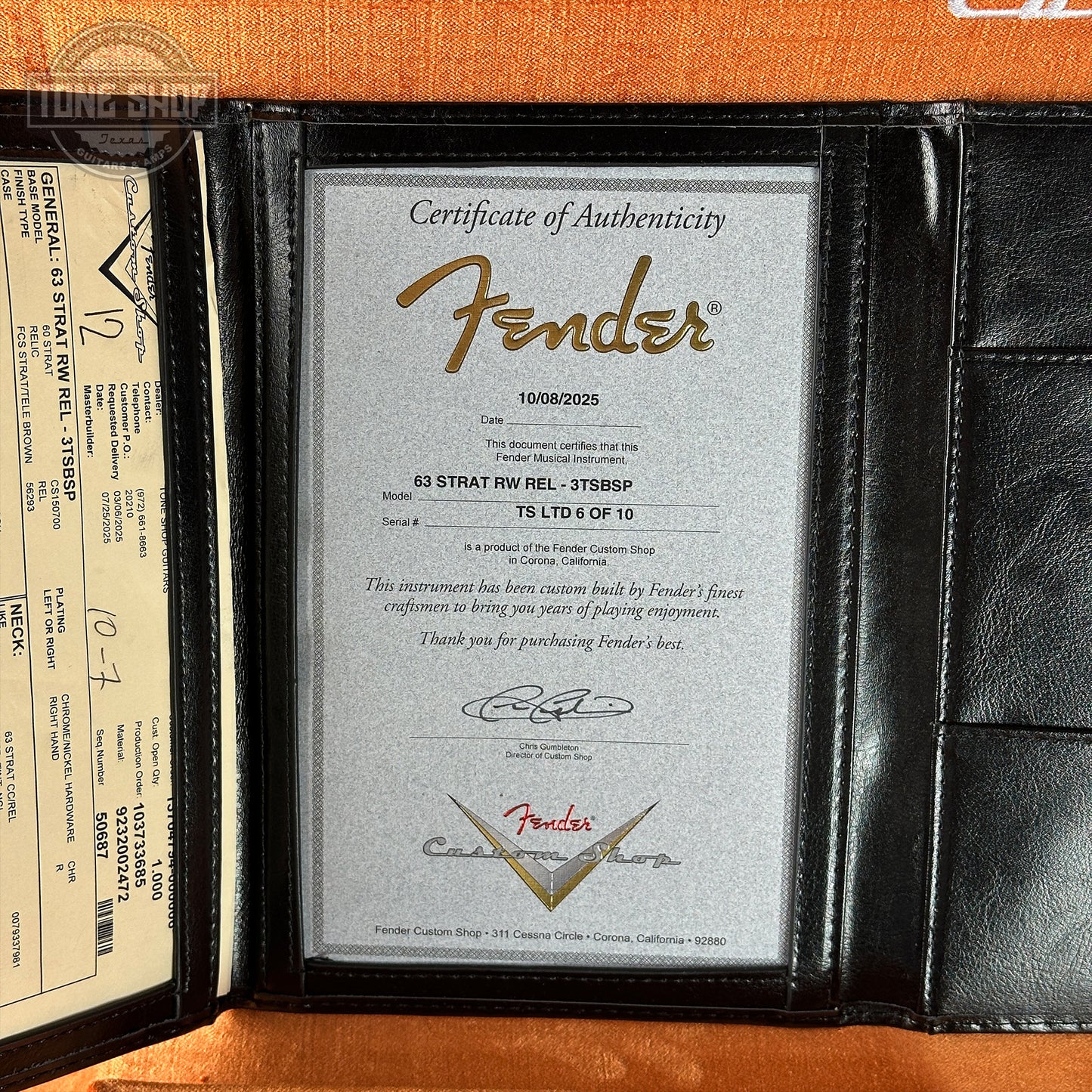 Fender certificate of authenticity in a black leather holder