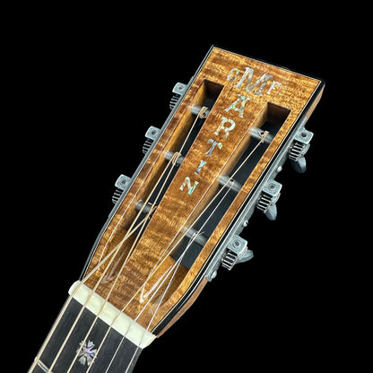 Front of headstock of Martin Custom Shop 42 Style 00-12F All Highly Flamed Koa w/Case.