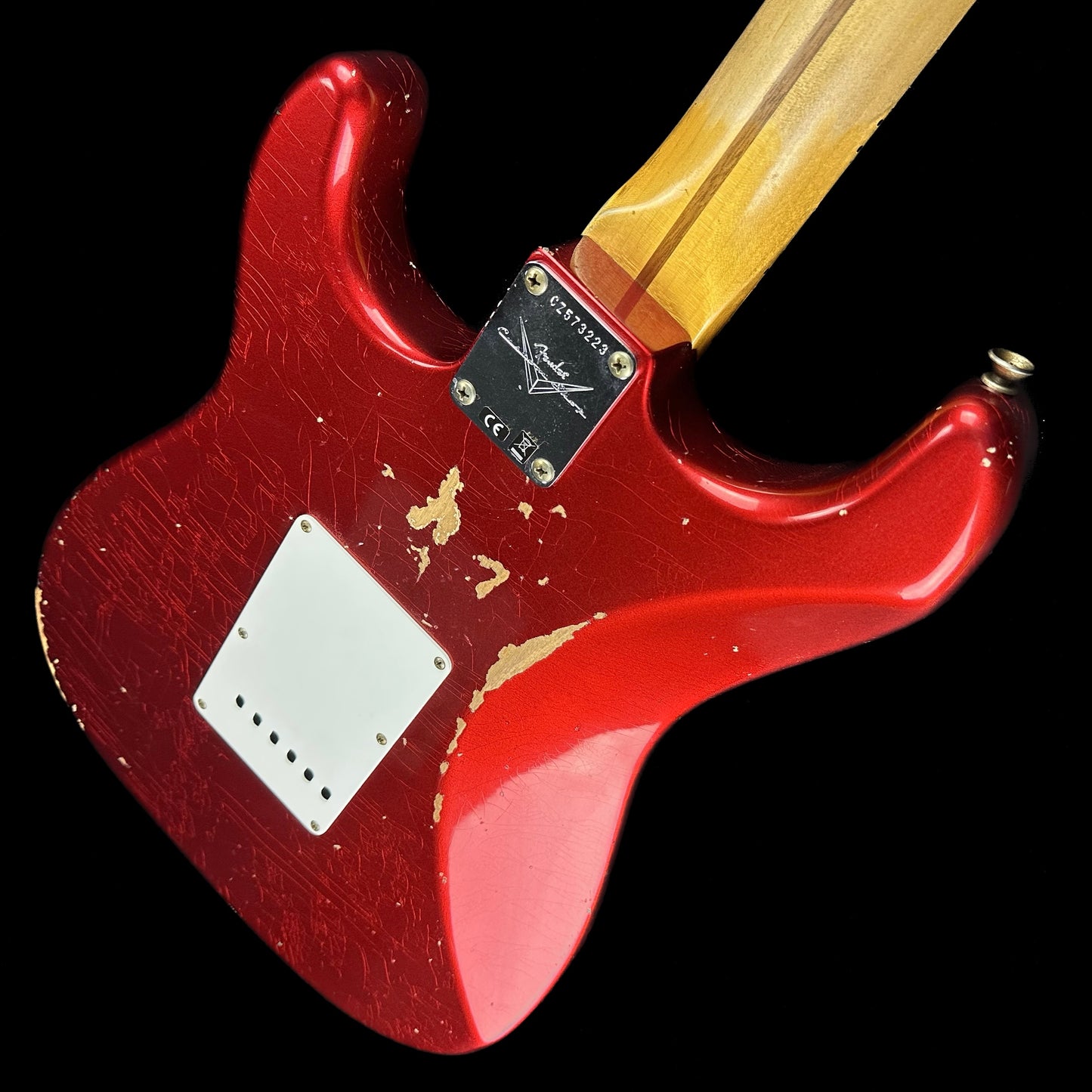Back angle of Fender Custom Shop 58 Strat Relic Faded Aged Candy Apple Red.