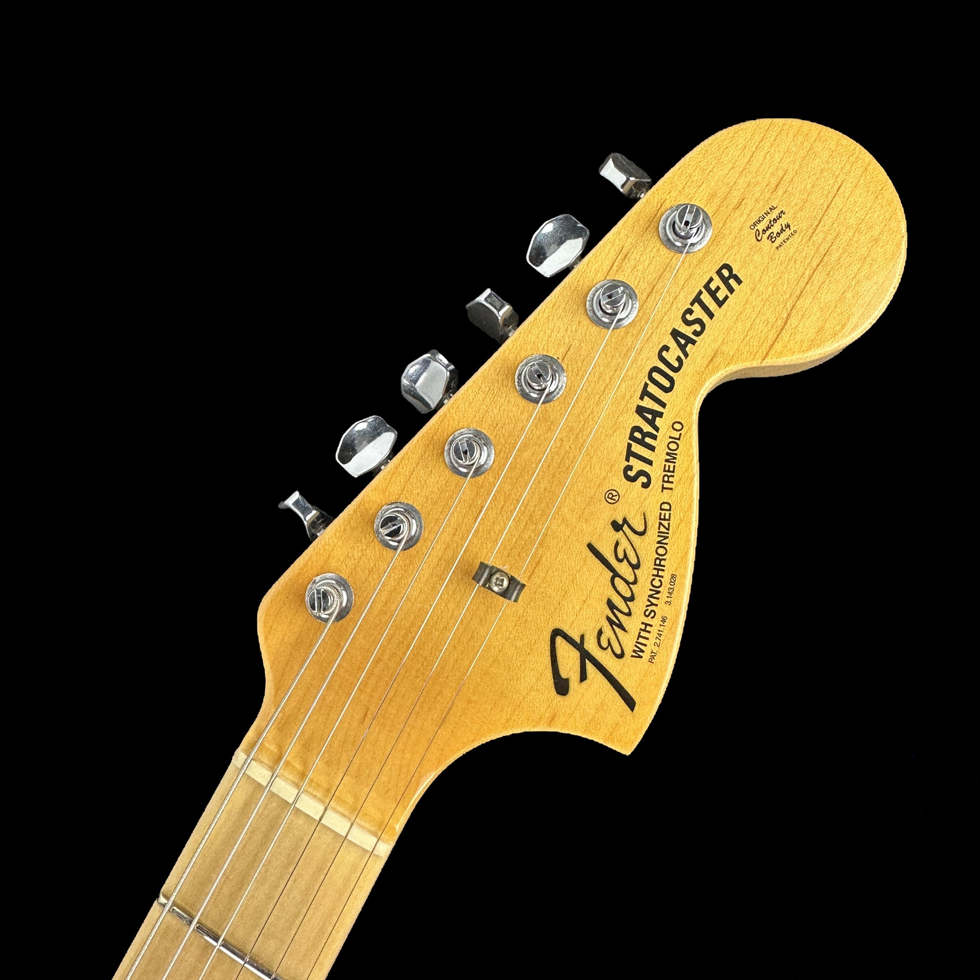 Front of headstock of Fender Custom Shop Limited Edition 1968 Stratocaster Relic Aged Black.