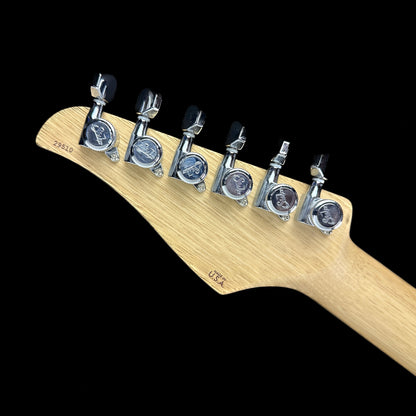 Back of headstock of Used Suhr Classic T Custom P90 Korina w/Spalted Maple Top.