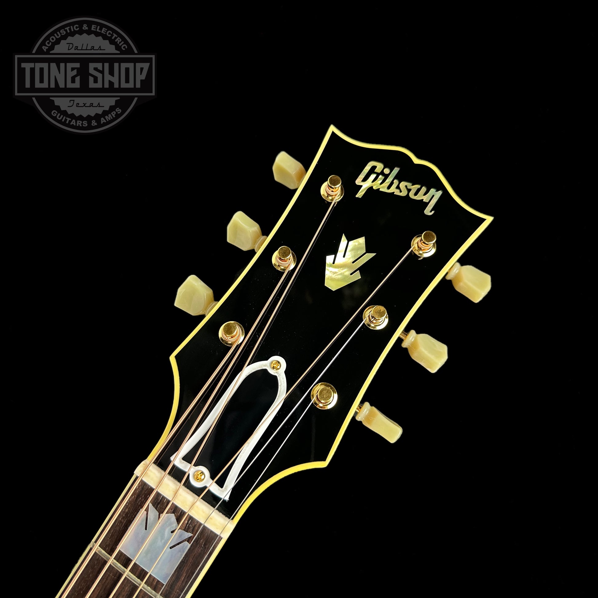 Front of headstock of Gibson Custom Shop M2M SJ-200 Original Cherry.