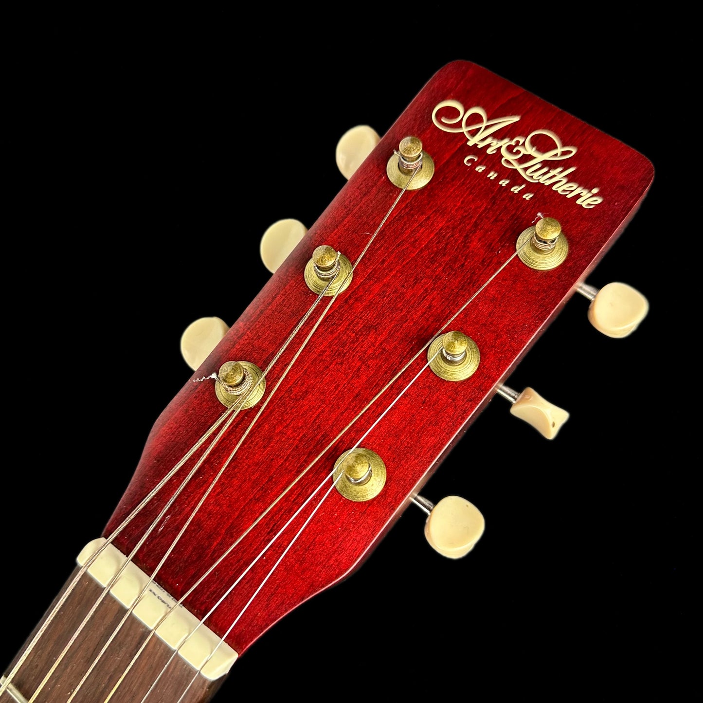 Headstock of Used Art & Lutherie Legacy Tennesse Red.