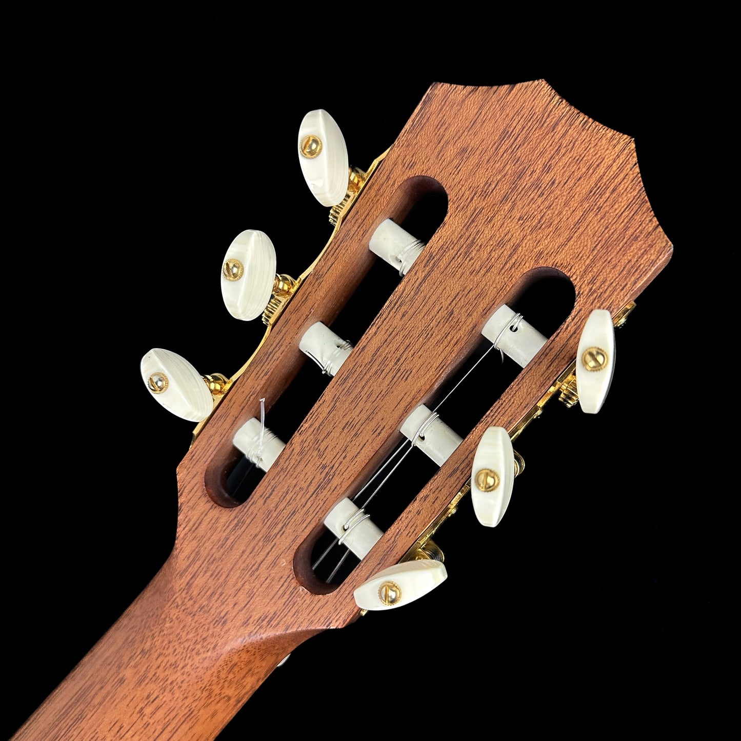 Back of headstock of Used 2004 Taylor NS72-CE.