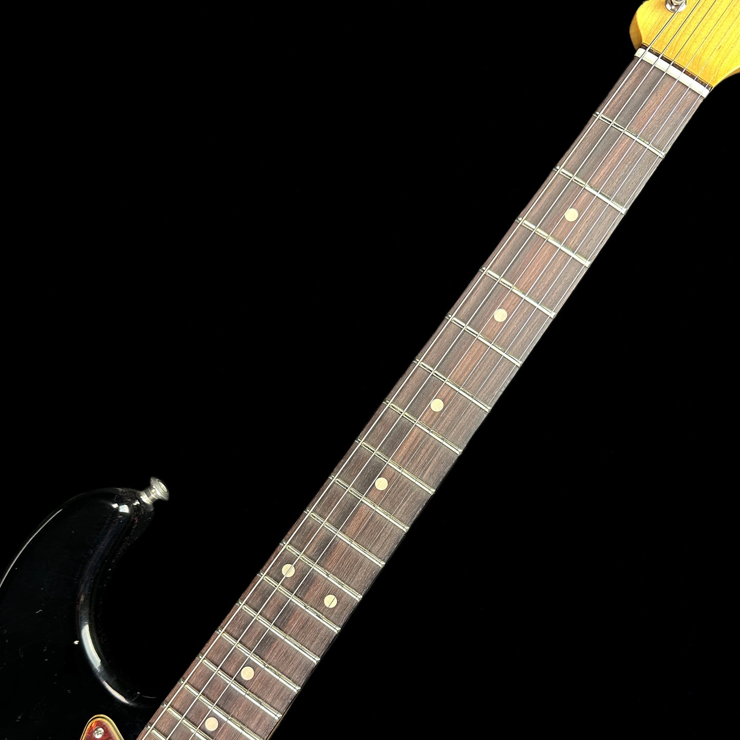 Fretboard of Fender Custom Shop Postmodern Strat RW Journeyman Relic w/Closet Classic Hardware Aged Black.