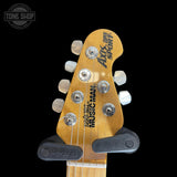 Headstock of Used 1999 Ernie Ball Music Man Axis Super Sport HH Hardtail Trans Gold.