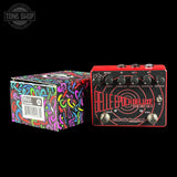 Guitar effects pedal with colorful packaging on a black background