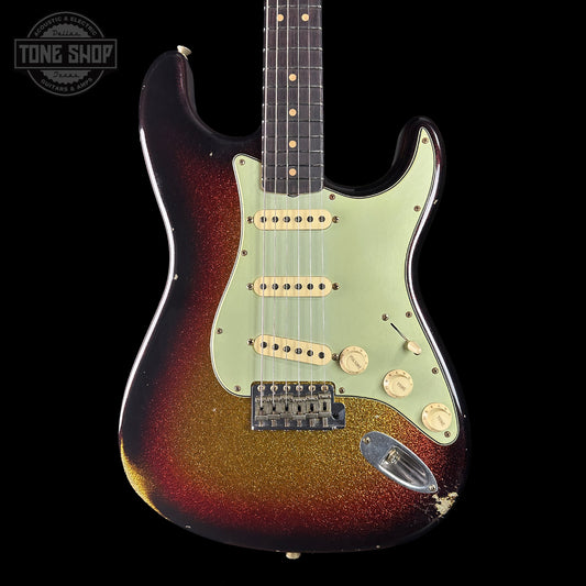 Electric guitar with sunburst finish on a black background, featuring 'Tone Shop' branding.