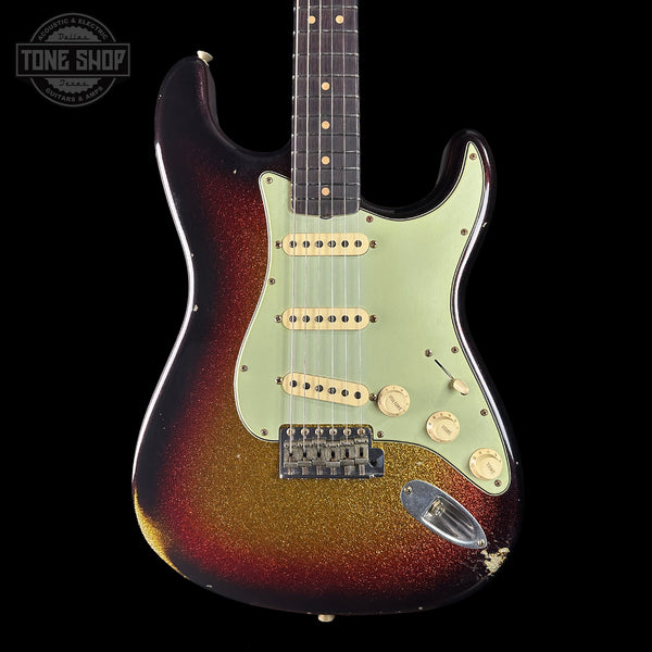 Electric guitar with sunburst finish on a black background, featuring 'Tone Shop' branding.