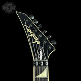 Guitar headstock with 'Jackson' branding on a black background