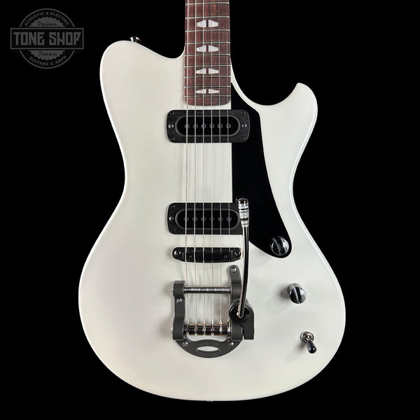 White electric guitar on a black background with 'Tone Shop' logo.