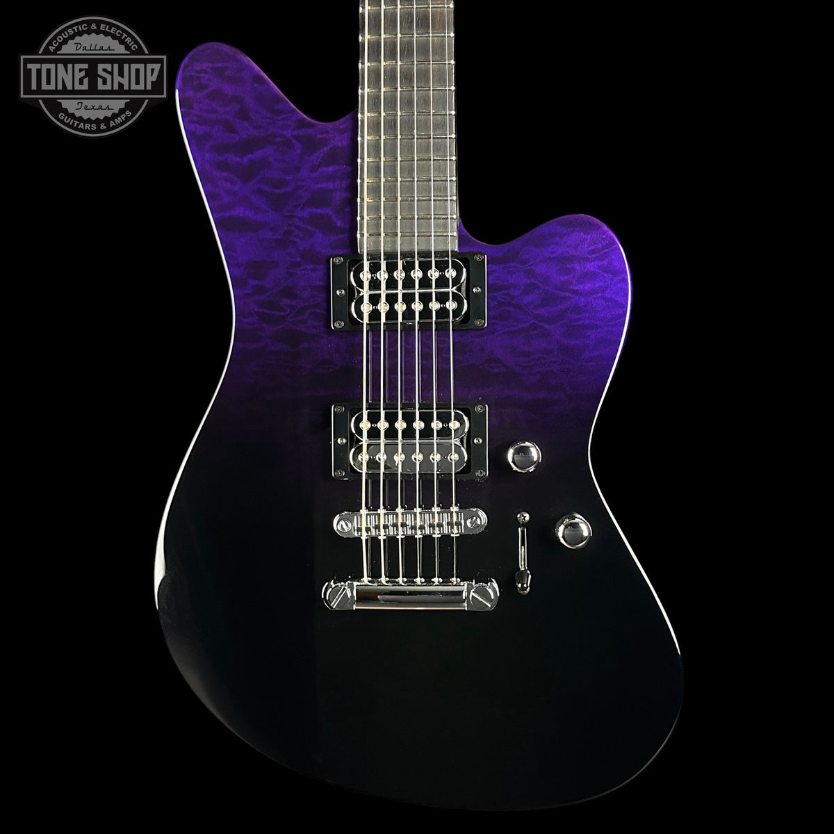 Purple electric guitar with a black background