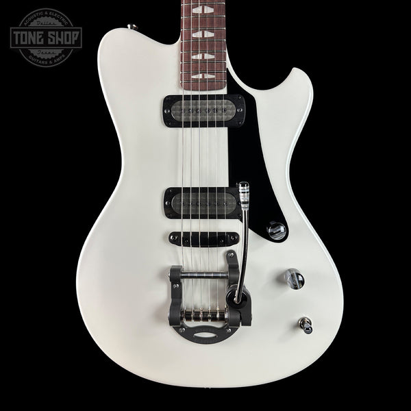 White electric guitar on a black background with 'Tone Shop' logo.