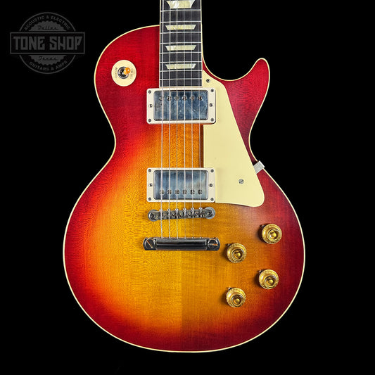 Gibson Les Paul guitar with a sunburst finish on a black background, featuring the Tone Shop logo.