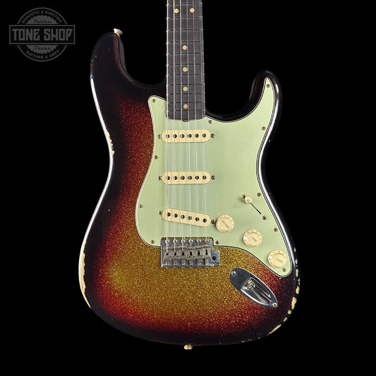 Fender Stratocaster guitar with a sunburst finish on a black background, featuring the Tone Shop logo.