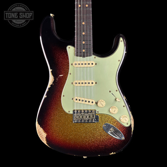 Fender Stratocaster guitar with sunburst finish on a black background, featuring 'Tone Shop' branding.