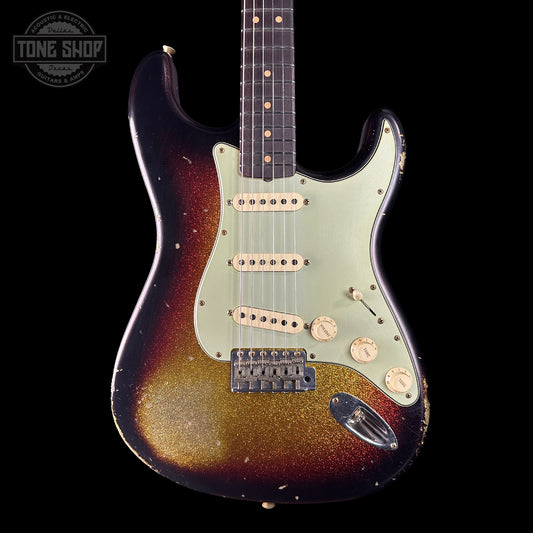 Electric guitar with a sunburst finish on a black background, featuring the Tone Shop logo.