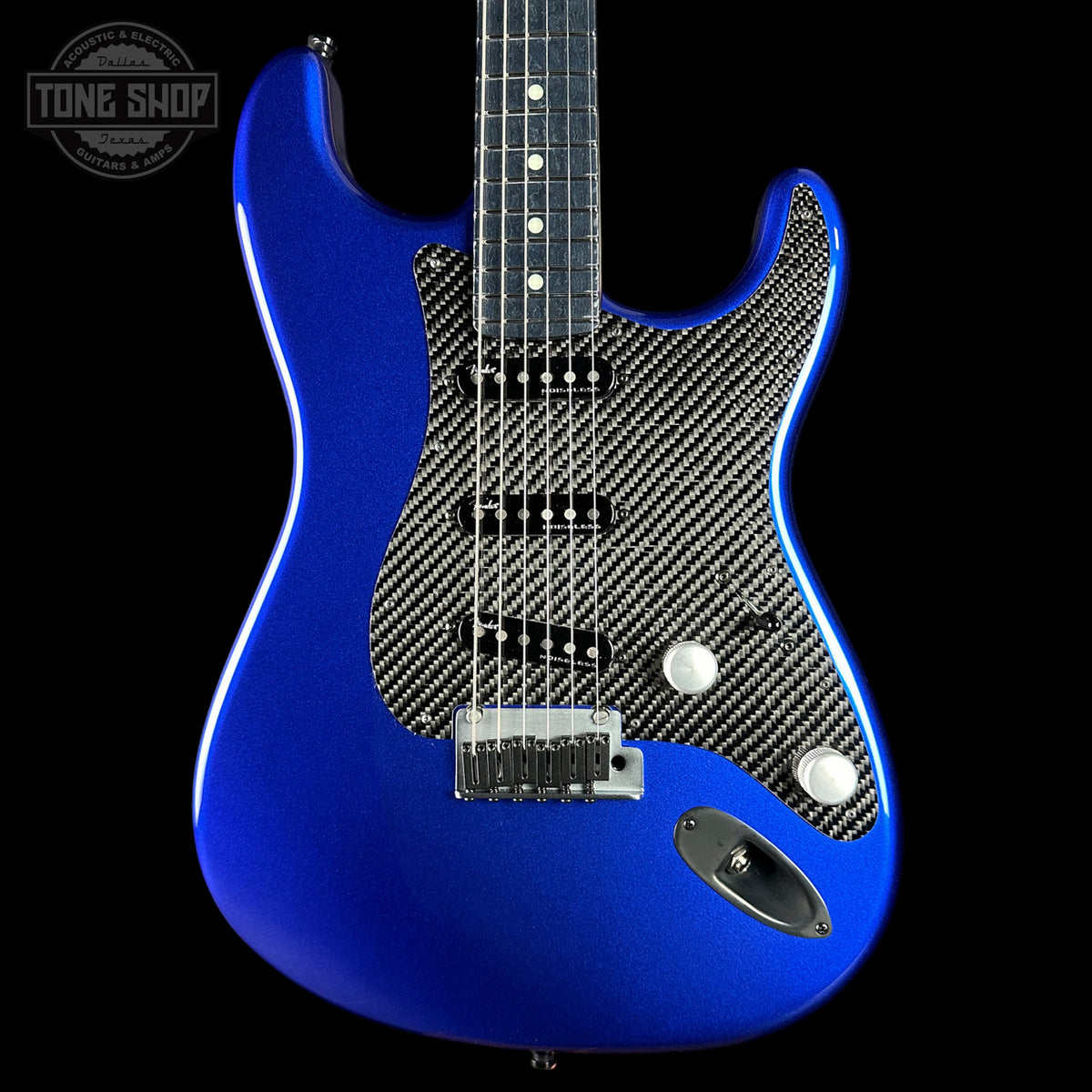 Blue electric guitar with carbon fiber pattern on a black background