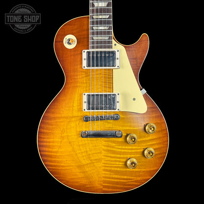 Gibson Les Paul electric guitar with a sunburst finish on a black background, featuring the Tone Shop logo.