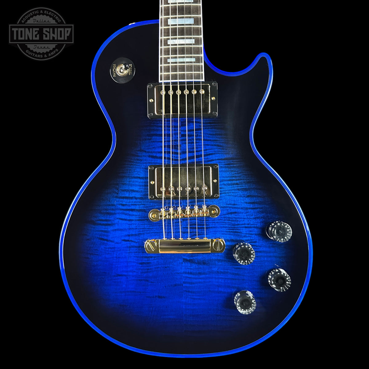 Blue electric guitar with a black background