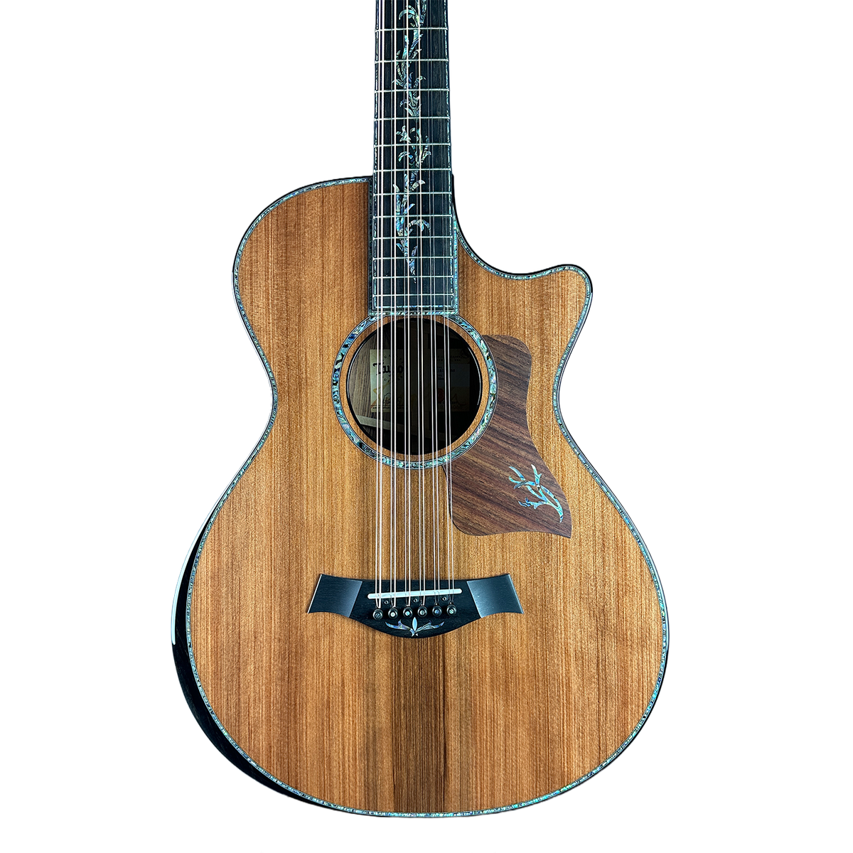 Acoustic guitar with a wooden finish on a white background