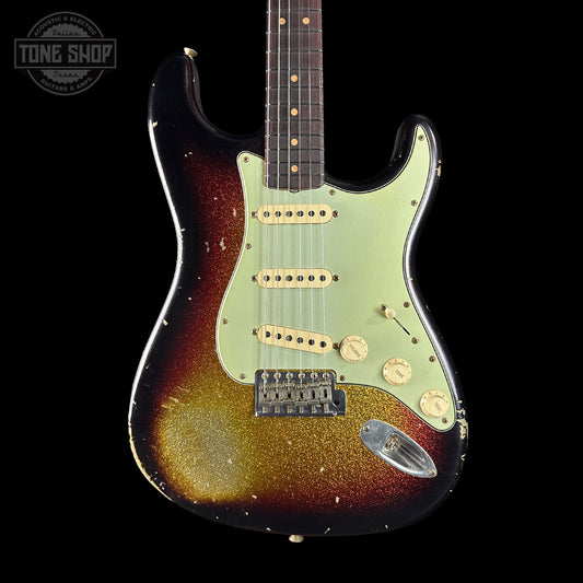 Fender Stratocaster guitar with sunburst finish on a black background