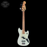 White electric bass guitar with a black pickguard on a white background, featuring the Tone Shop logo.