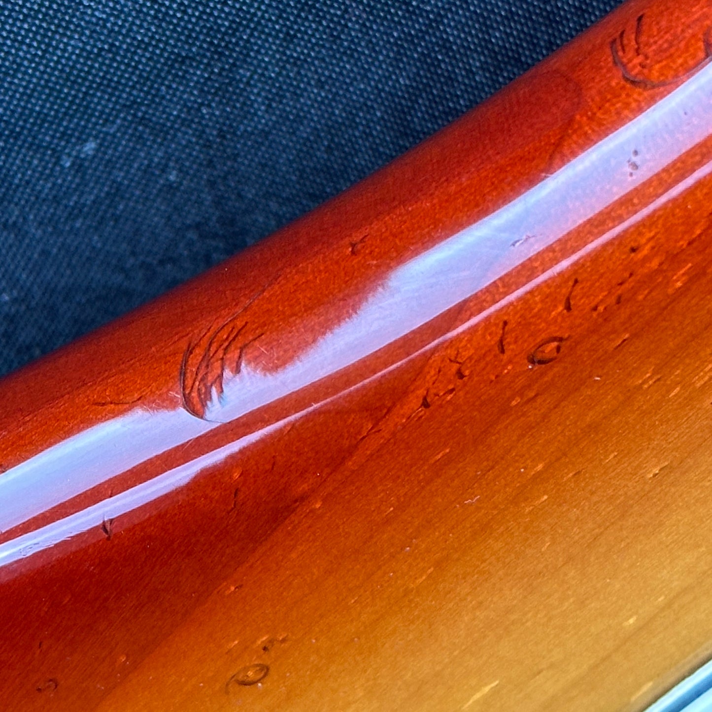 Damage on side of Used 1983 Fender Elite Precision Bass II Sienna Burst.