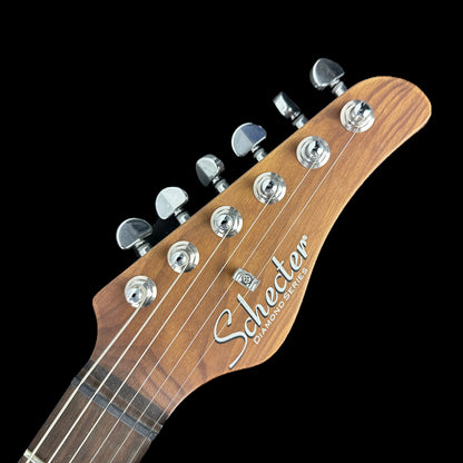 Front of headstock of Used Schecter Nick Johnston Traditional HSS Atomic Mist.