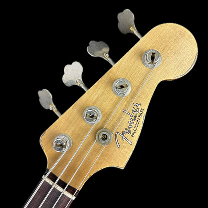 Front of headstock of Fender Custom Shop Limited Edition '63 Precision Bass Heavy Relic Faded Aged 3 Color Sunburst.