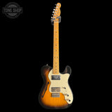 Electric guitar with a sunburst finish on a black background, featuring the Tone Shop logo.
