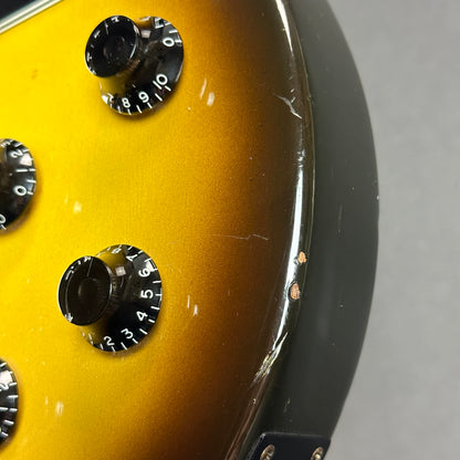 Damage near controls of Used 1989 Gibson Les Paul Special Burst.
