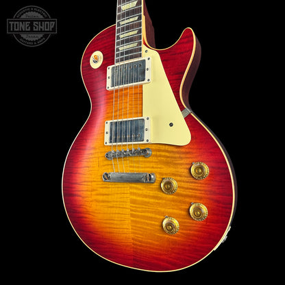 Electric guitar with a sunburst finish on a black background, featuring the Tone Shop logo.