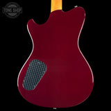 Back view of a red electric guitar with a black 'Tone Shop' logo in the corner.