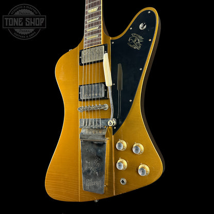 Gibson electric guitar with a black pickguard on a black background, featuring the Tone Shop logo.