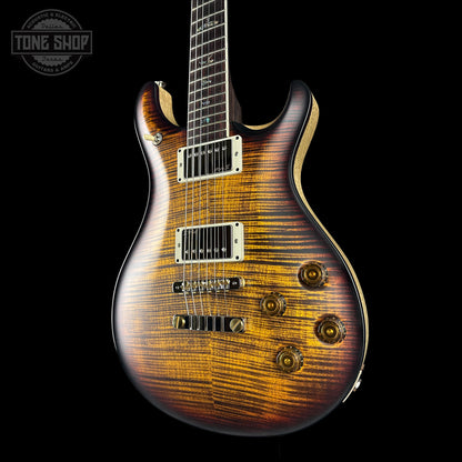 electric guitar with a wavy finish on a black background, featuring the Tone Shop logo.